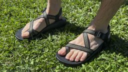 Man wearing Chaco Z/2 Sandals in grass