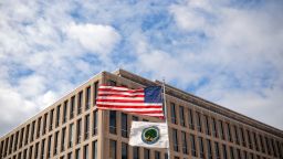 The American flag and Department of Education flags whip in the wind outside the department's headquarters in Washington, DC, in March.