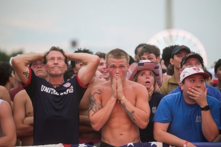 People react after Belgium scored during the World Cup match between the United States and Belgium, at the FIFA Fan Zone on Monday, July 6.