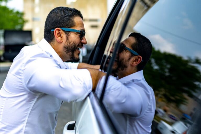 El-Sayed speaks to Larry Nix as he pulls up to