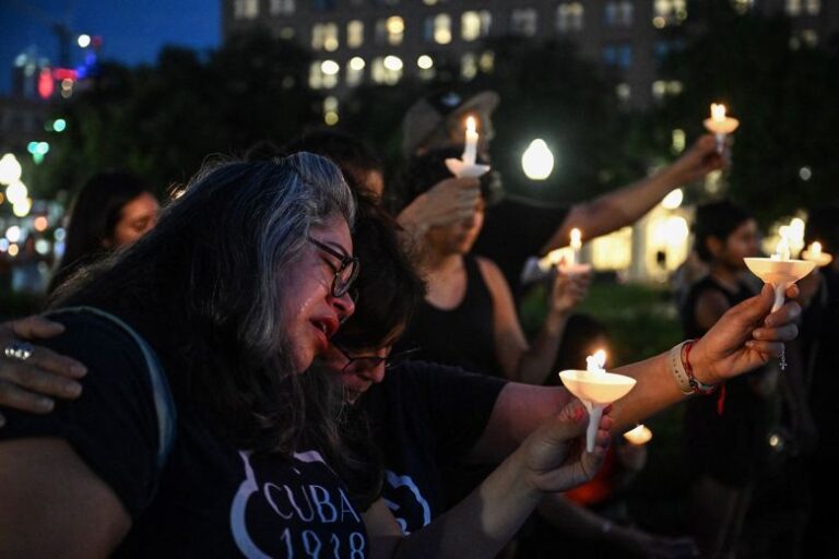 People mourn during a vigil in San Antonio, Texas, on July 7, 2026.