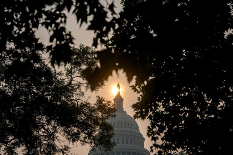 The sun rises above the US Capitol on July 17.
