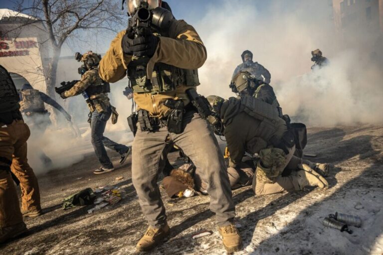 Federal agents confront protestors in Minneapolis during clashes in the aftermath of a fatal shooting on January 24. Earlier in the day Alex Pretti, a 37-year-old Minneapolis resident, <a href=
