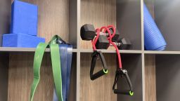 Strength training equipment in gym cubbies.