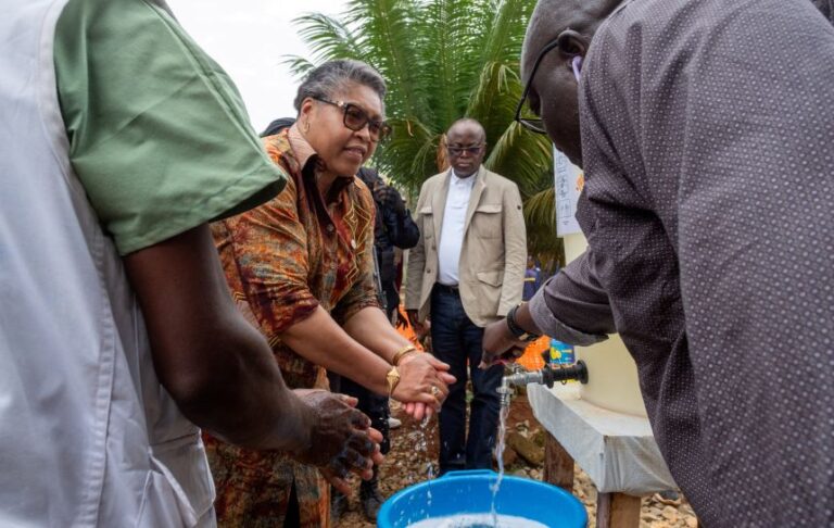 Democratic Republic of Congo Prime Minister Judith Suminwa Tuluka washes her hands while touring Mongbwalu General Hospital on July 24.