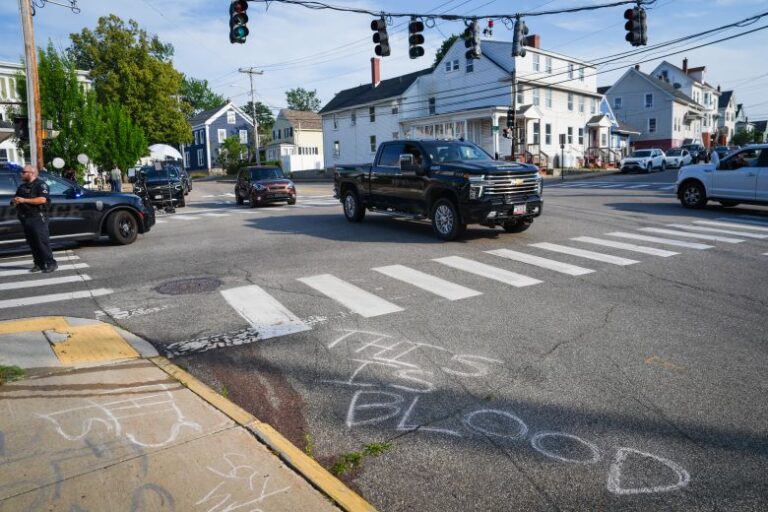 Blood is seen on the pavement at the scene of a shooting involving US Immigration and Customs Enforcement (ICE), on July 13, 2026 in Biddeford, Maine.