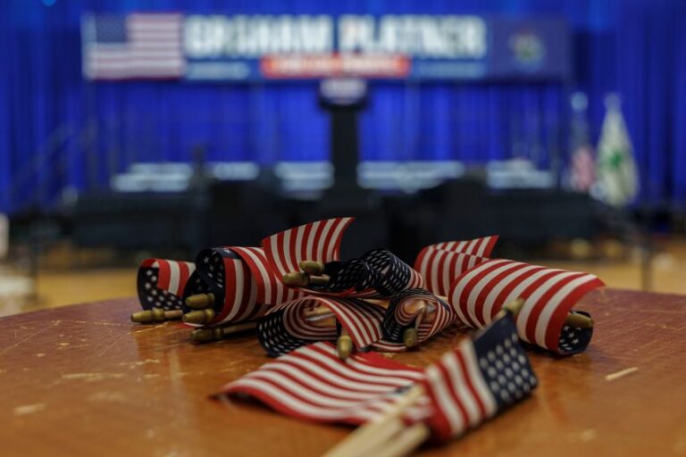 American flags are seen on a table at the primary election event for Graham Platner in Blue Hill, Maine, on June 9.