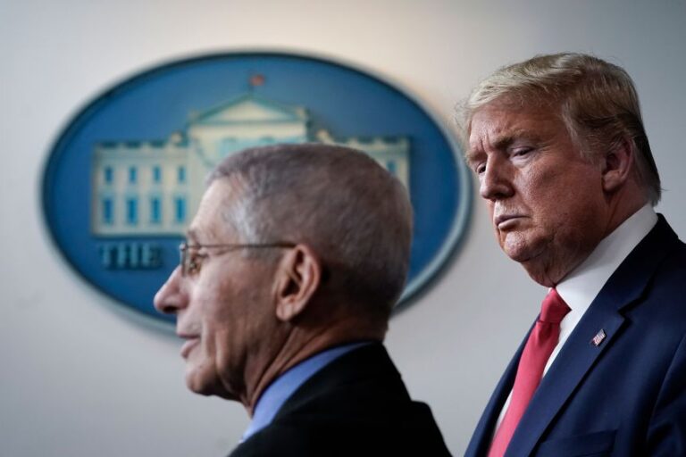 Dr. Anthony Fauci, director of the National Institute of Allergy and Infectious Diseases, speaks as  President Donald Trump looks on during a briefing on the coronavirus pandemic, in the press briefing room of the White House on March 24, 2020 in Washington, DC.