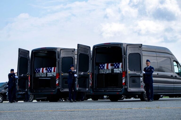 The carrying cases of Army 1st Lt. Tyler James Feehan, Army Staff Sgt. Emmanuel Swinton, Army Sgt. Angel Rampersad and Army Pvt. Isabella Gonzales are placed in the transfer vehicles after a dignified transfer at Dover Air Force Base in Dover, Delaware on July 22.