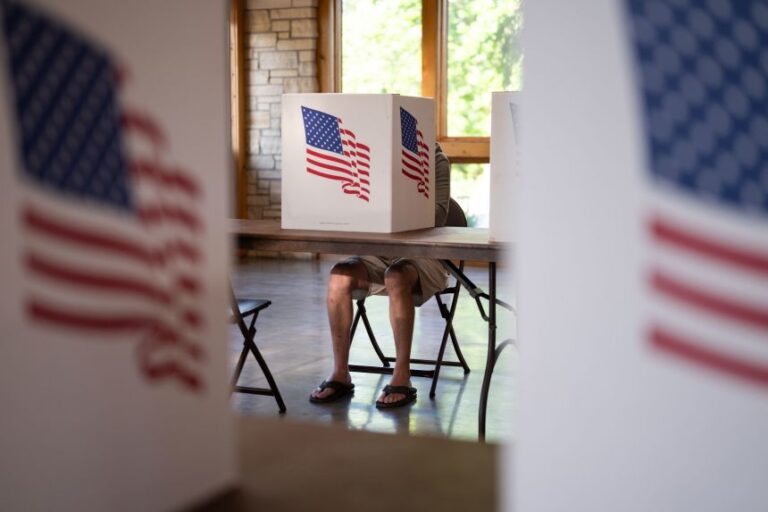A voter fills out their ballot at a polling place in Marion, Iowa, on June 2.