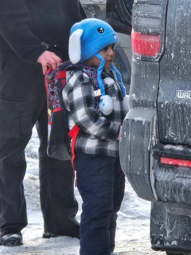 Federal immigration agents walk 5-year-old Liam Conejo Ramos to a vehicle in front of his Minneapolis home, on January 20.
