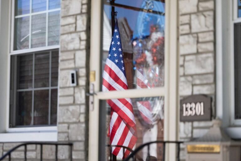 An American flag flies at half-staff outside the home of the family of fallen US soldier Sgt. Angel S. Rampersad, who was killed during an Iranian attack in Jordan, in New York, on July 23.