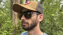 Man wearing Ombraz sports sunglasses on a hike
