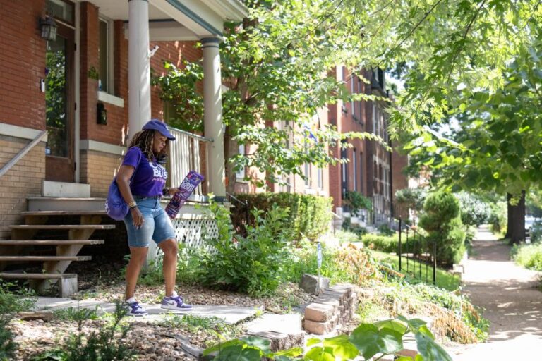 Former Rep. Cori Bush canvasses a neighborhood in St. Louis, on July 18.