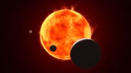 The Earth-size exoplanet TRAPPIST-1 e, depicted at the lower right, is silhouetted as it passes in front of its flaring host star in this artist’s concept of the TRAPPIST-1 system.