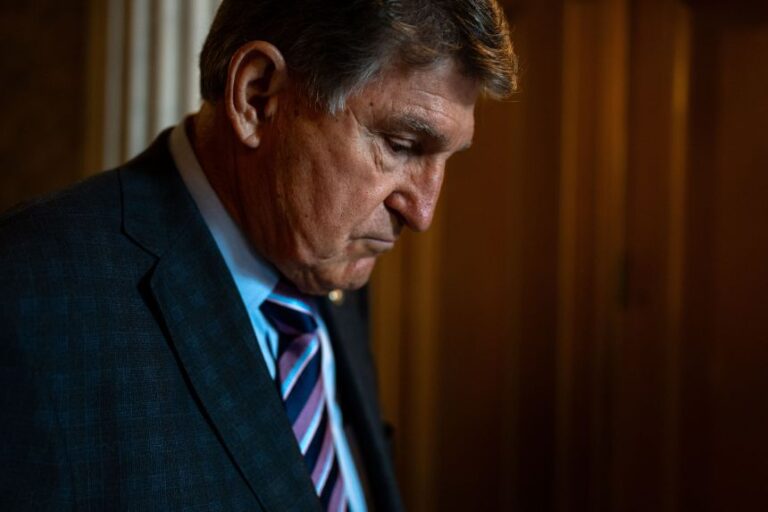 Sen. Joe Manchin walks out from the Senate chamber in July 2024.