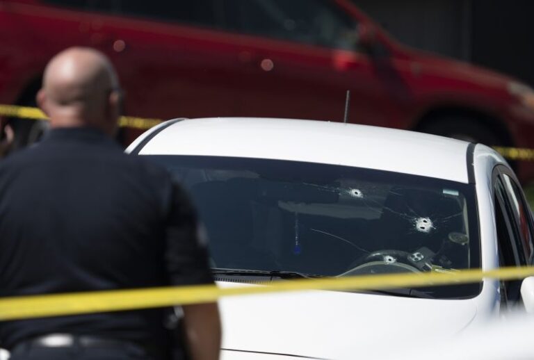 A Kia sedan reportedly driven by the victim of a fatal shooting can be seen with four bullet holes in the windshield at the scene on Pool Street in Biddeford on Monday, July 13, 2026.
