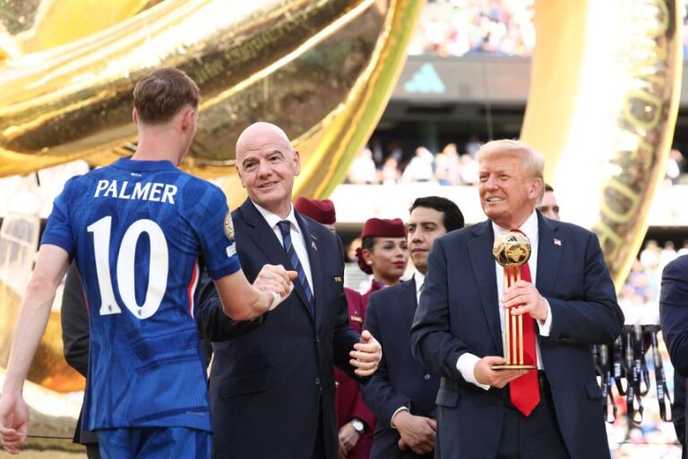 FIFA President Gianni Infantino and US President Donald Trump present a trophy at MetLife Stadium in East Rutherford, New Jersey, on July 13, 2025.