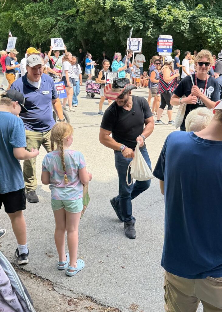 Abdul El-Sayed marches in the same parade.