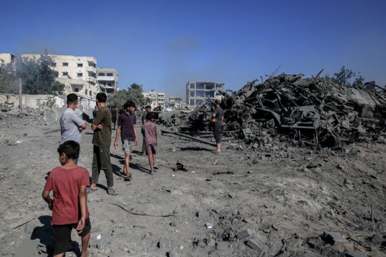 Palestinians inspect the damage following an Israeli airstrike in Gaza on July 12, 2026.