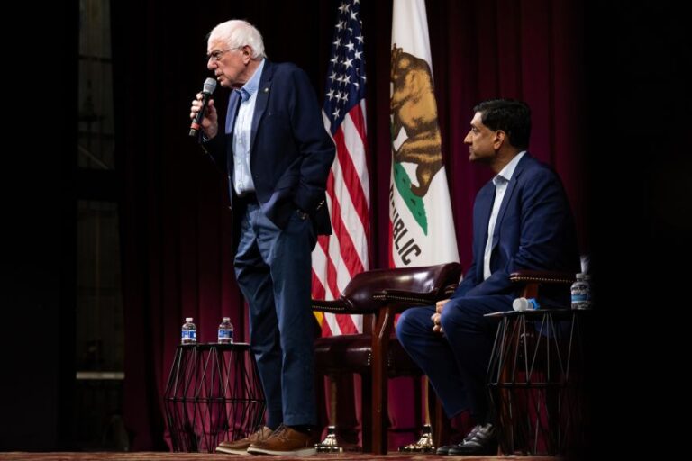 Senator Bernie Sanders speaks next to US Rep. Ro Khanna at a town hall event on February 20, 2026 in Stanford, California.