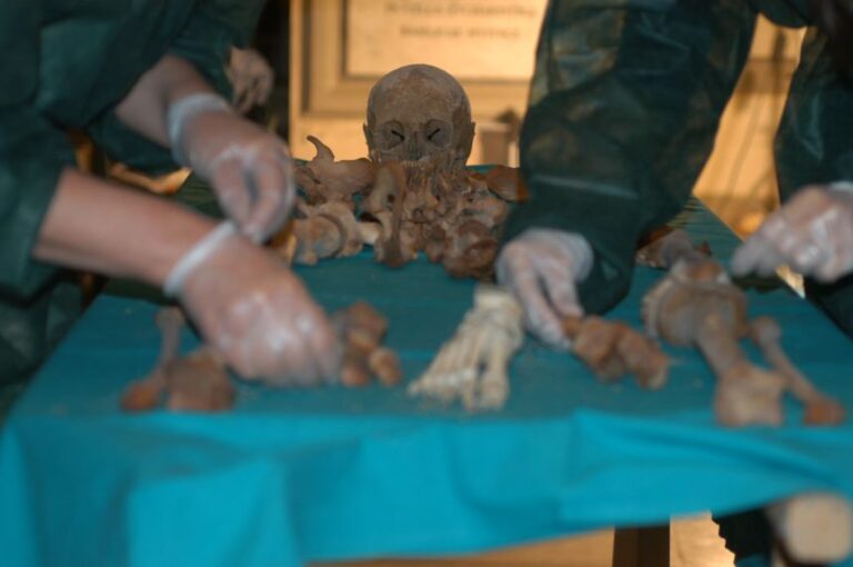 Researchers work on remains exhumed from the Medici Tombs in Florence.