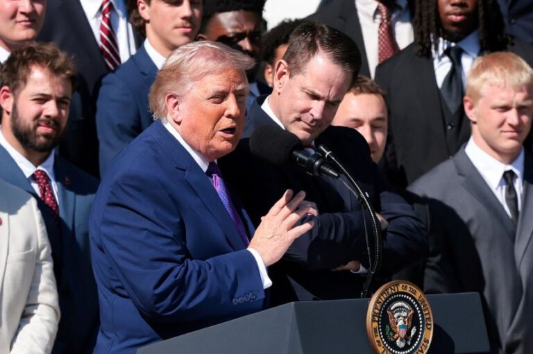 President Donald Trump speaks next to Indiana University head football coach Curt Cignetti, as he hosts the 2026 College Football Playoff National Champions at the White House on May 11.