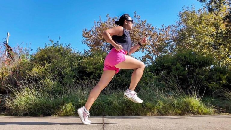 Female runner sprinting outside