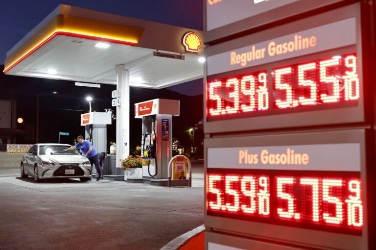 A customer washes their windshield near gas prices displayed at a gas station on July 7, 2026 in Pasadena, California. According to a new Guardian poll, 95 percent of Americans think that the United States is in the midst of an affordability crisis with many reporting trouble affording necessities like gas and groceries.