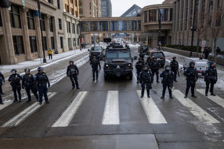 Minneapolis police block off a street with a armored SWAT vehicle during a rally against ICE, on January 17.