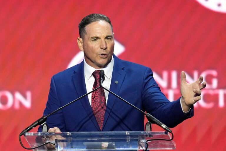 Former NFL football kicker Jay Feely speaks at a Turning Point USA event in Phoenix, Arizona, on April 17, 2026.