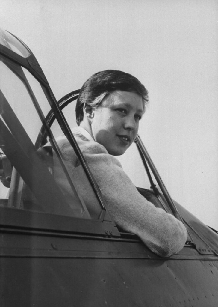 Funk sits in the cockpit of an AT-6 training plane at Hawthorne airport October 01, 1961.