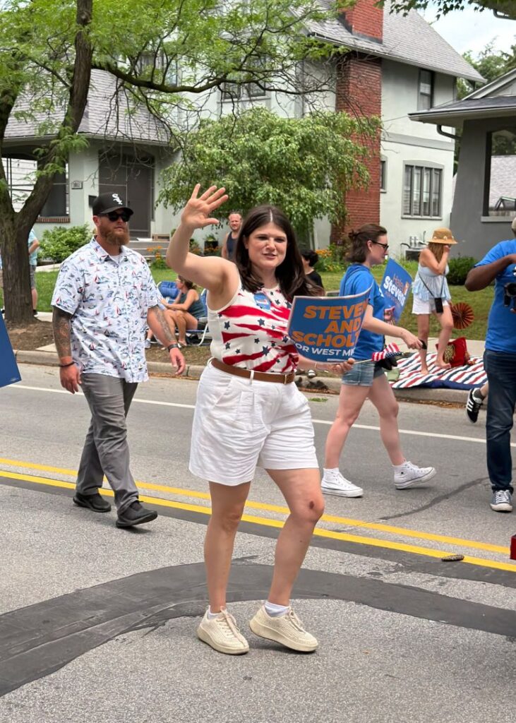 Rep. Haley Stevens marches in an Independence Day parade in Grand Rapids, Michigan, on July 4.