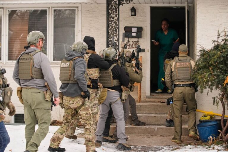Teyana Gibson Brown reacts after a federal immigration officer used a battering ram to break down a door before arresting her husband, Garrison Gibson, in Minneapolis on January 11.