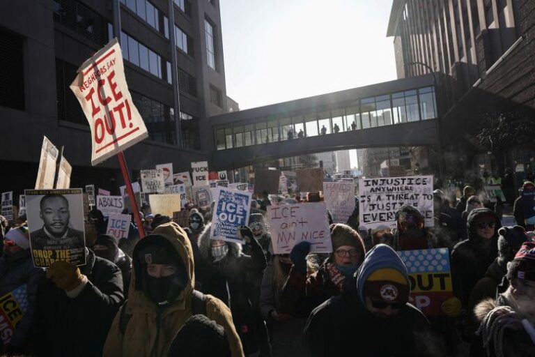 People take part in a rally on the day of a general strike to protest President Donald Trump's deployment of immigration enforcement officers to Minneapolis, on January 23.
