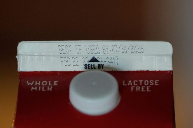 A Best If Used By date is stamped above a Sell By label on a milk carton, Tuesday, June 30, 2026, in San Francisco.