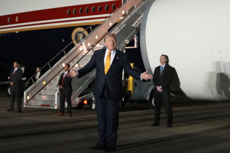 President Donald Trump speaks as he switches planes at RAF Mildenhall in England, on his way back to Washington, DC, from the NATO summit in Ankara, Turkey, on Wednesday.