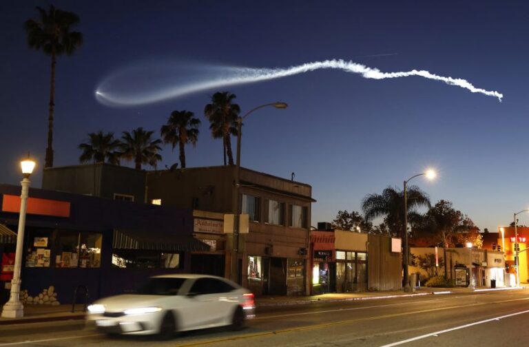A SpaceX Falcon 9 rocket rises after launching from Vandenberg Space Force Base carrying 25 Starlink internet satellites, as seen from Pasadena, California, on April 6.