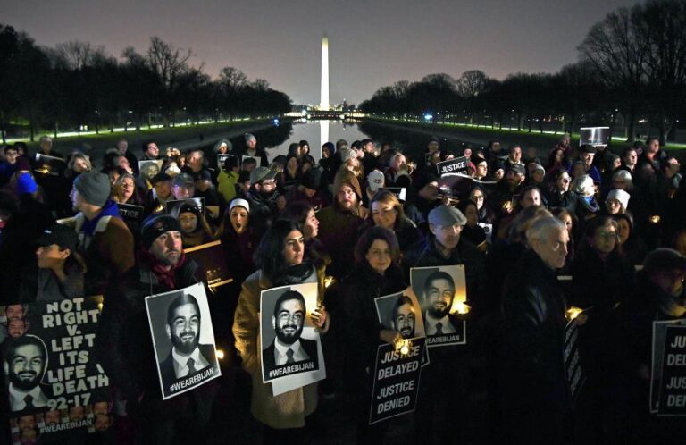 People gather during a vigil for Bijan Ghaisar, who was fatally shot by two US Park Police officers, at the Lincoln Memorial on November 17, 2018, the one-year anniversary of the shooting.