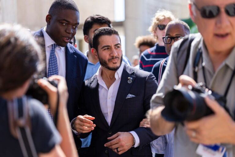 Michigan Democratic Senate primary winner Abdul El-Sayed leaves after holding a press conference in front of the Spirit of Detroit statue on Wednesday.