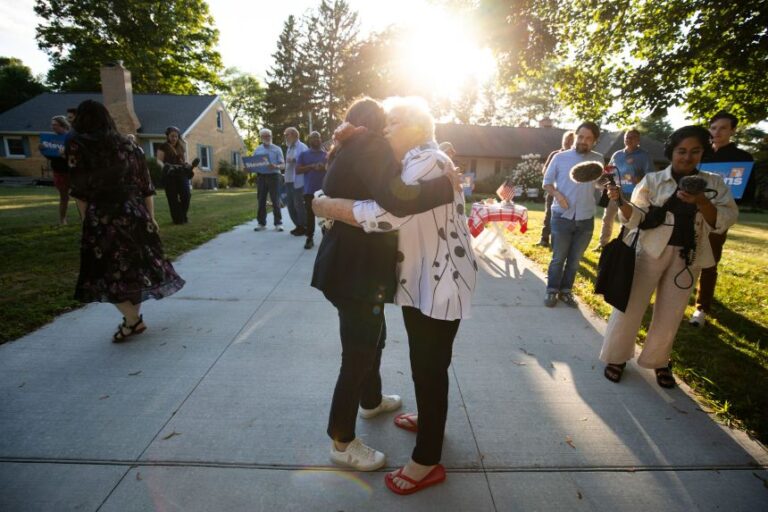 Rep. Haley Stevens hugs a supporter at a canvass launch in Okemos, Michigan, on July 29, 2026.