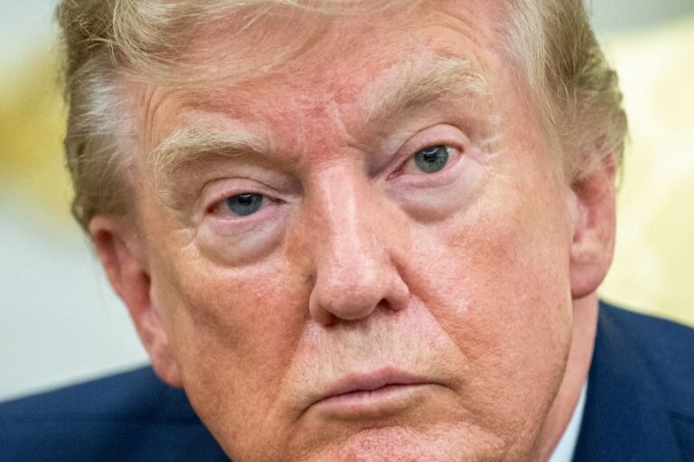 President Donald Trump looks in the Oval Office of the White House on Monday, August 17.
