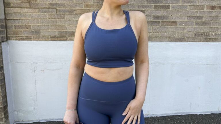 A woman wearing a Spanx Cooling Sports Bra