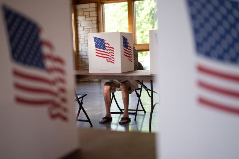 A voter fills out their ballot at a polling place in Marion, Iowa, during the state's primary election on June 2.