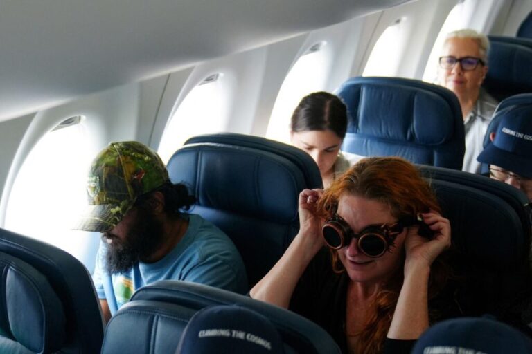 Passengers sit on a special <a href=