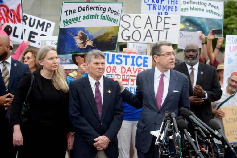 Former Olympic canoeist David Hearn listens as his attorney Norman Eisen speaks on July 9, in Washington, DC, after he pleaded not guilty to allegedly damaging the Lincoln Memorial Reflecting Pool.
