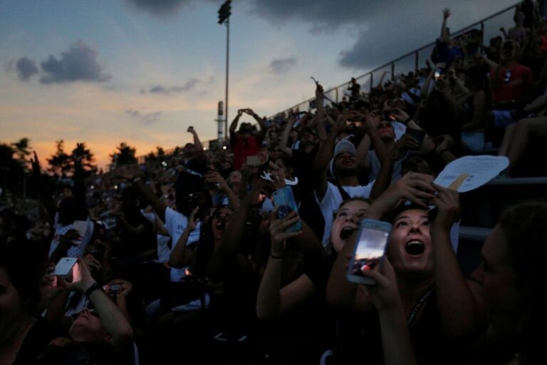 People react to the total eclipse at Southern Illinois University in Carbondale, Illinois, on August 21, 2017.