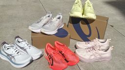 A collection of five Asics running shoes lined up next to each other.