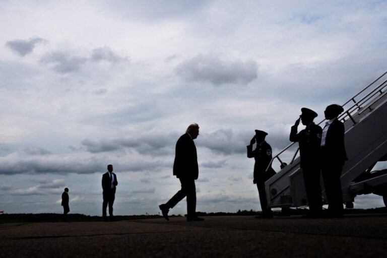 US President Donald Trump walks to board Air Force One at Morristown Municipal Airport in Morristown, New Jersey, on Sunday.