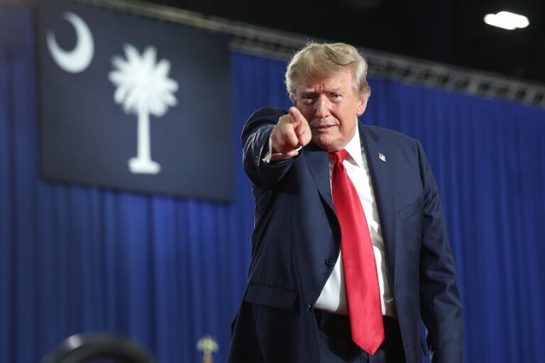 President Donald Trump leaves the stage after speaking at a campaign rally with Sen. Darline Graham, in Myrtle Beach, South Carolina, on August 21.